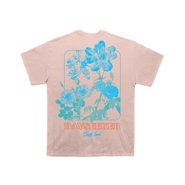 Our Return Tee, a short sleeve t-shirt featured in light colors with our logo and a print of some nice flowers